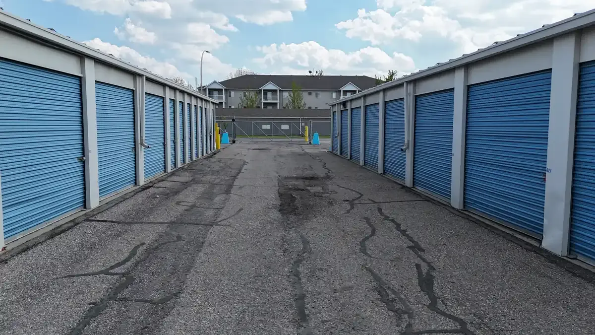 Wide driveway with drive up units and roll up doors. 